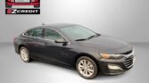 Dark gray Chevrolet Malibu shown from the side with EZ Credit logo in the top-left corner and 'APPLY, ARRIVE & DRIVE!' slogan along the bottom.