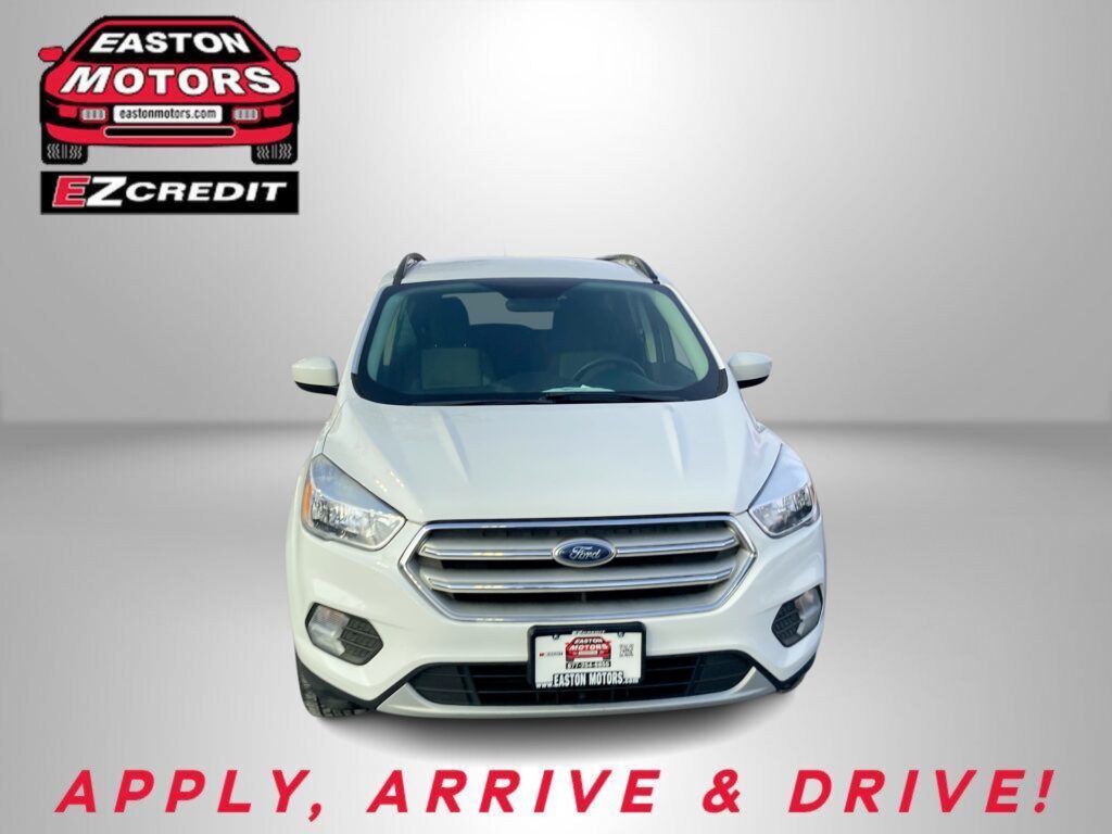 Red car front view with Easton Motors logo in top-left and 'APPLY, ARRIVE & DRIVE!' text at bottom; dealership banner image.