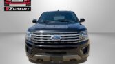 Front view of a dark blue Ford SUV against a gray backdrop with an Easton Motors EZ Credit logo on the left and red 'APPLY, ARRIVE & DRIVE!' text below.