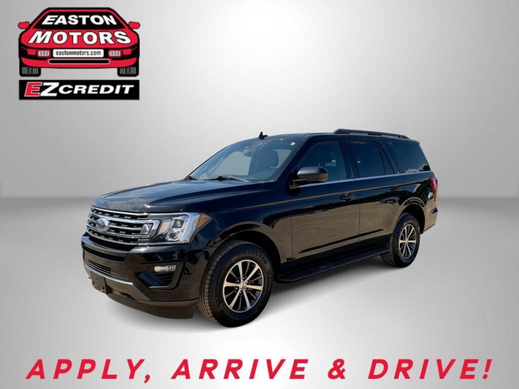 Dark blue Ford SUV against a gray gradient; Easton Motors EZ Credit logo in the top-left corner and 'APPLY, ARRIVE & DRIVE!' at the bottom.
