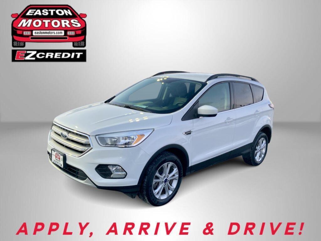 White SUV displayed on a gray background with EZ Credit logo in the top left and 'APPLY, ARRIVE & DRIVE!' text at bottom.