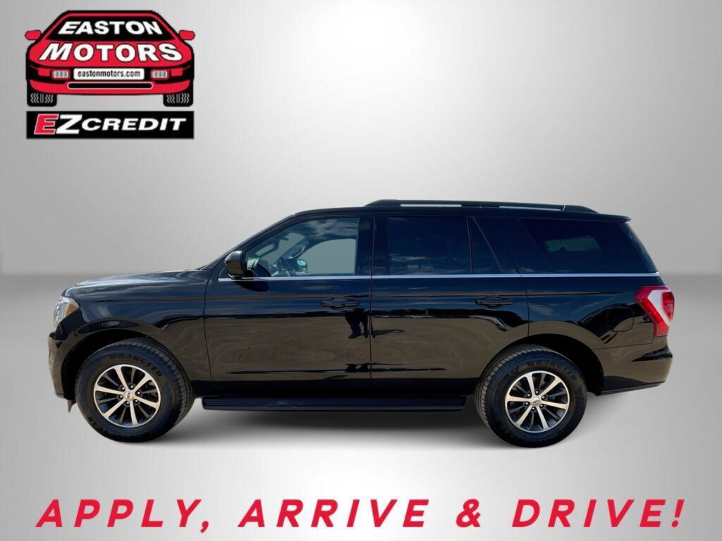 Black SUV in profile view against a gray backdrop, with Easton Motors EZ Credit logo in the top left and red 'APPLY, ARRIVE & DRIVE!' text along the bottom.