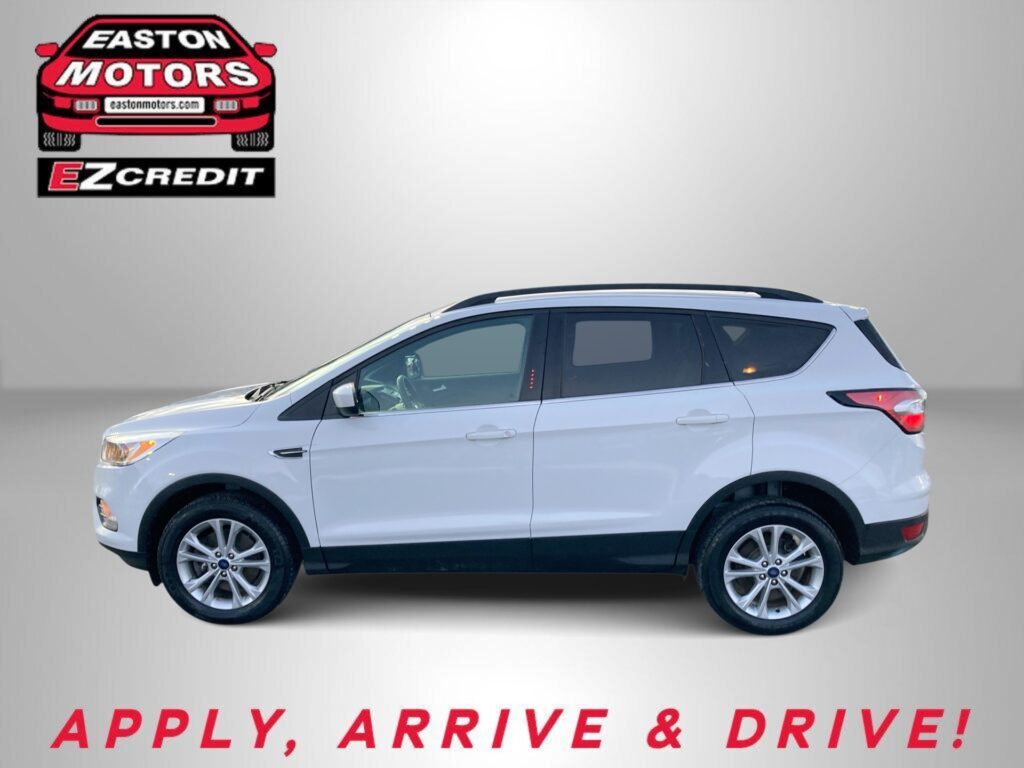 White SUV on a gray gradient background, with Easton Motors EZCredit logo in the top left and the red slogan 'APPLY, ARRIVE & DRIVE!' at the bottom.