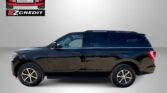 Black SUV in profile view against a gray backdrop, with Easton Motors EZ Credit logo in the top left and red 'APPLY, ARRIVE & DRIVE!' text along the bottom.