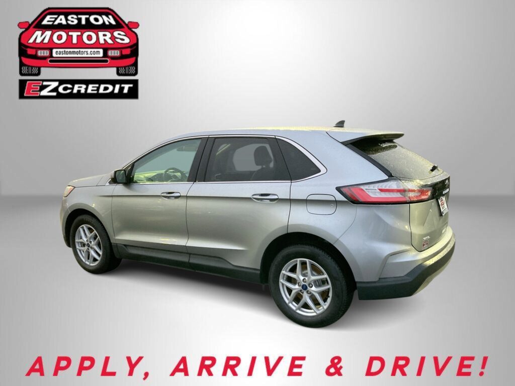 Red car graphic with Easton Motors logo in top left and 'EZCREDIT' below; silver SUV on a gray backdrop with 'APPLY, ARRIVE & DRIVE!' text at bottom.