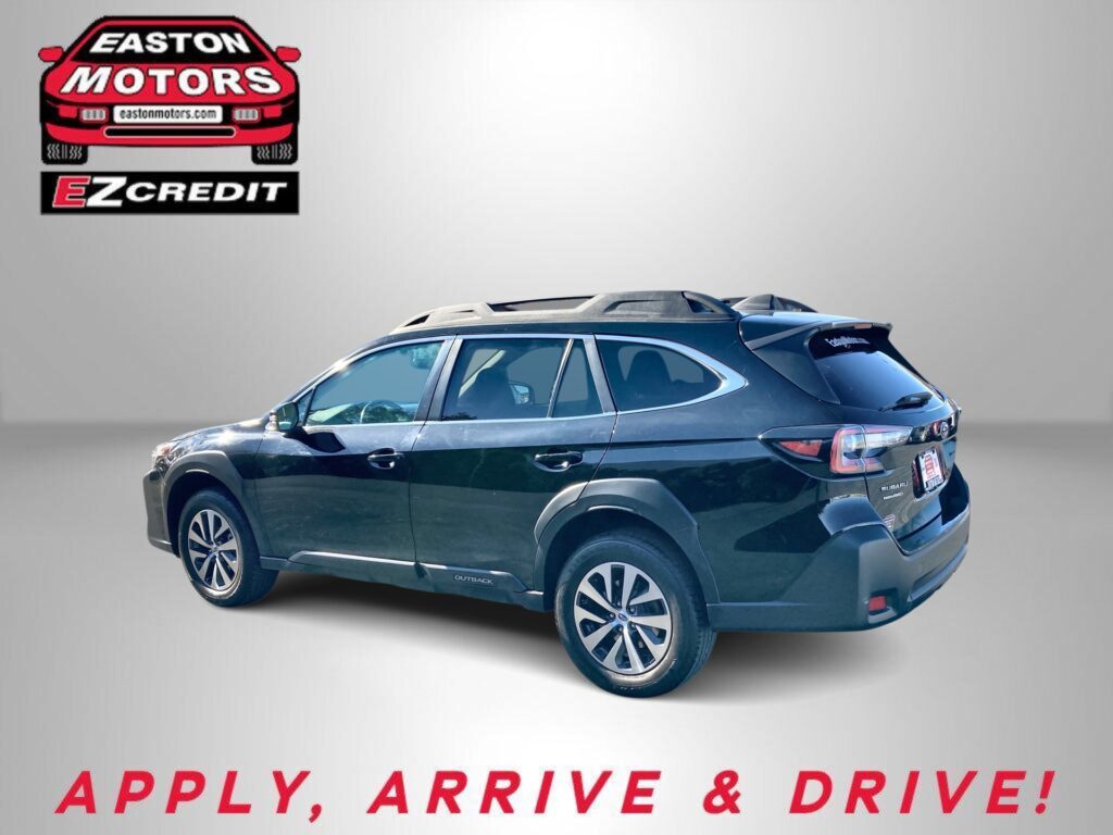 Blue SUV with roof rails shown from rear side, against a gray gradient background; EZCredit logo in the top left corner and the slogan 'APPLY, ARRIVE & DRIVE!' at the bottom.