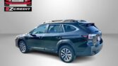 Blue SUV with roof rails shown from rear side, against a gray gradient background; EZCredit logo in the top left corner and the slogan 'APPLY, ARRIVE & DRIVE!' at the bottom.