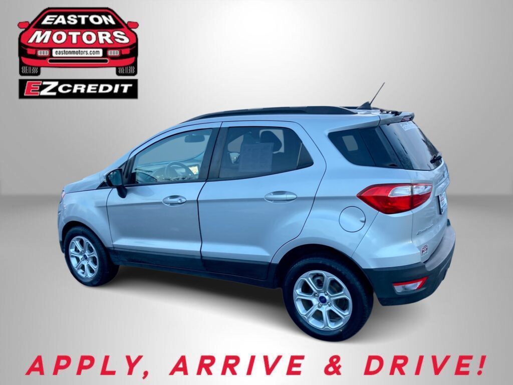 Light blue SUV in an Easton Motors ad with EZ Credit logo; slogan 'APPLY, ARRIVE & DRIVE!' below.
