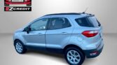 Light blue SUV in an Easton Motors ad with EZ Credit logo; slogan 'APPLY, ARRIVE & DRIVE!' below.