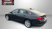 Black Chevrolet Malibu rear three-quarter view with Easton Motors EZCredit logo in the upper left and the slogan 'APPLY, ARRIVE & DRIVE!' at the bottom.