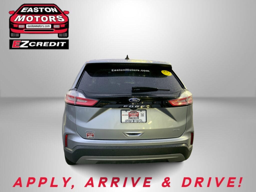 Rear view of a silver Ford SUV with Easton Motors logo in the top left and the slogan 'APPLY, ARRIVE & DRIVE!' in red lettering along the bottom (advertising).