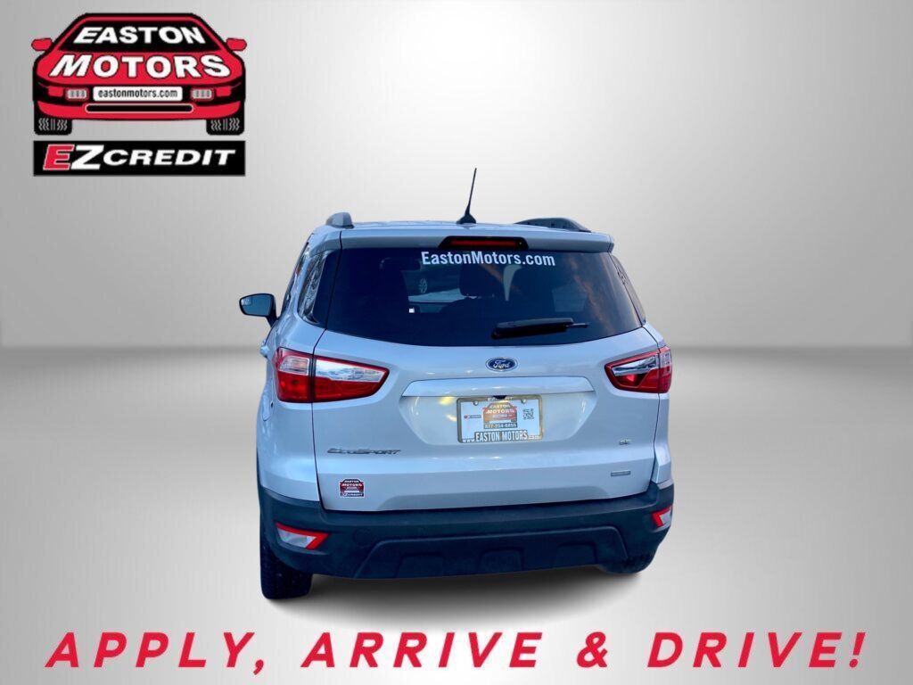 Rear view of a light-blue SUV with Easton Motors logo on the left, 'EastonMotors.com' on the rear window, and red 'APPLY, ARRIVE & DRIVE!' text at the bottom.