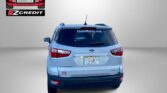 Rear view of a light-blue SUV with Easton Motors logo on the left, 'EastonMotors.com' on the rear window, and red 'APPLY, ARRIVE & DRIVE!' text at the bottom.