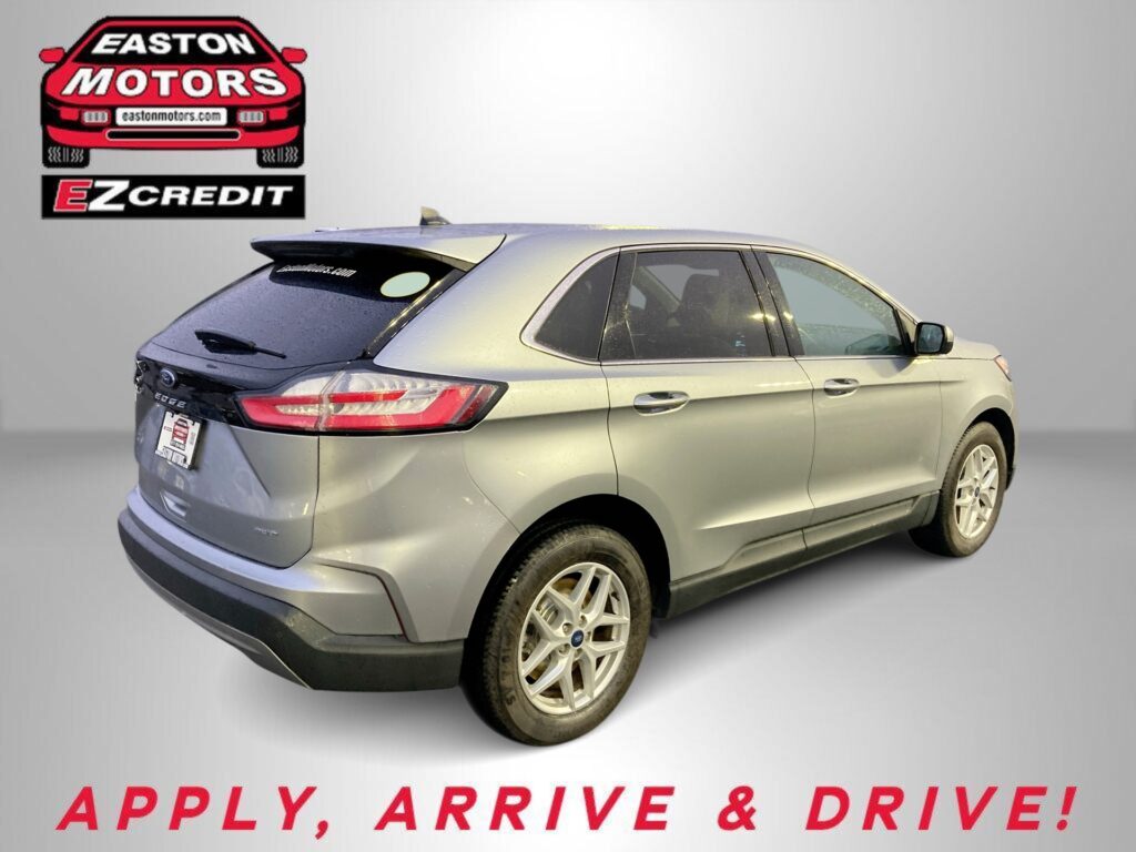 Silver Ford Edge SUV shown from rear-left with Easton Motors EZ Credit logo and 'APPLY, ARRIVE & DRIVE!' slogan in the background.
