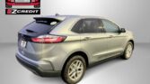 Silver Ford Edge SUV shown from rear-left with Easton Motors EZ Credit logo and 'APPLY, ARRIVE & DRIVE!' slogan in the background.