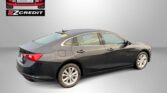 Gray sedan with Easton Motors EZ Credit logo in the top-left and the words “APPLY, ARRIVE & DRIVE!” below the car, on a gray backdrop.