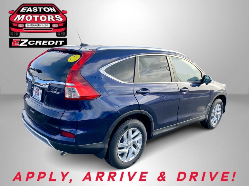 Blue Honda SUV takes up the foreground against a gray backdrop, with an EZ Credit logo on the left and red text reading 'APPLY, ARRIVE & DRIVE!' at the bottom.