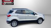 Silver SUV photographed against a gray backdrop with Easton Motors EZCredit logo in the top left and 'APPLY, ARRIVE & DRIVE!' slogan at the bottom.