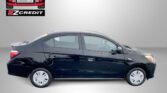 Black sedan shown in profile with Easton Motors logo above and EZ Credit branding on a gray backdrop, plus an 'APPLY, ARRIVE & DRIVE!' slogan partially visible.