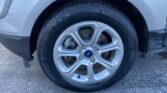 Wheel of a blue Ford vehicle showing alloy rim, brake disc, and tire with size 205/60R16 visible on the sidewall