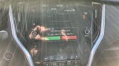 Dashboard touchscreen showing climate controls and infotainment prompts; 'No Device Connected' message on screen with drive mode indicators and controls nearby.