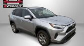 Silver SUV parked with Easton Motors logo and EZCredit branding in a showroom-like background; promo text reads Apply, Arrive & Drive!
