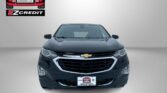 Front view of a black Chevrolet SUV with the Easton Motors logo on the wall behind it.