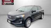 Easton Motors EZCredit logo on the left with a gray Ford SUV angled to the right, set against a light gradient background; bottom text reads 'APPLY, ARRIVE & DRIVE!'