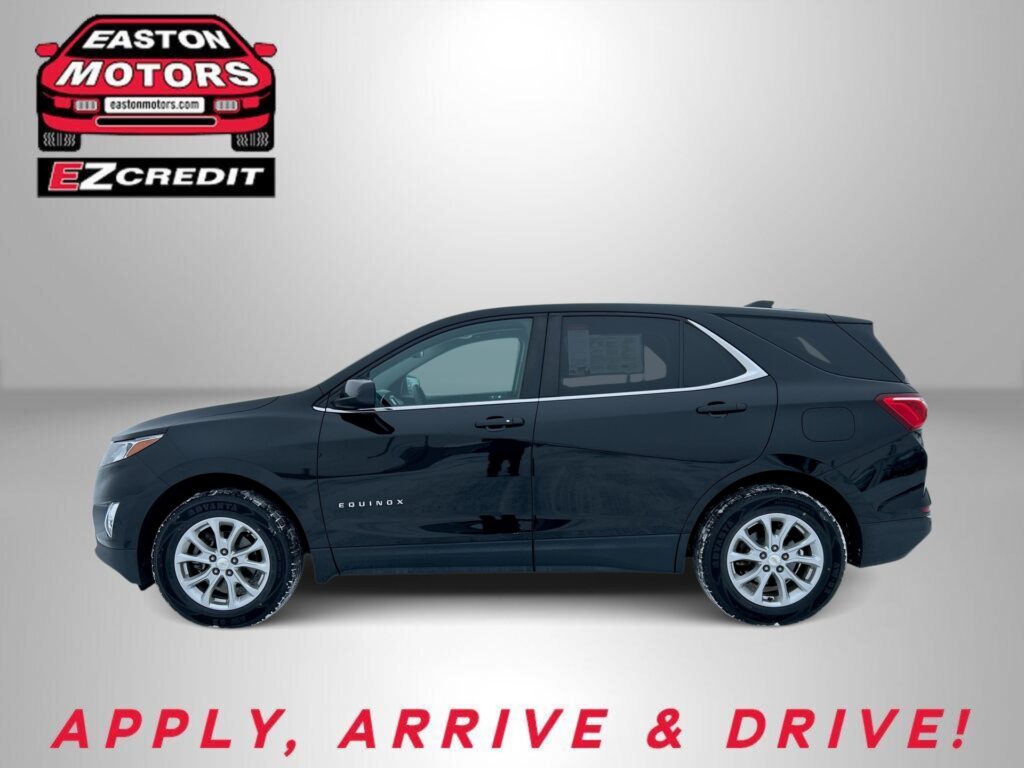 Black SUV (Chevrolet Equinox) against a grey background with EZ Credit logo in the top-left corner; text 'APPLY, ARRIVE & DRIVE!' shown at bottom.