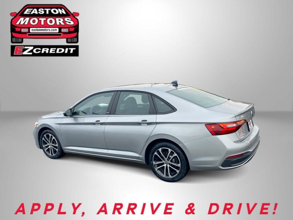 Silver sedan in a studio setting with Easton Motors logo in the top-left corner and red 'APPLY, ARRIVE & DRIVE!' text along the bottom.