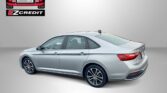 Silver sedan in a studio setting with Easton Motors logo in the top-left corner and red 'APPLY, ARRIVE & DRIVE!' text along the bottom.