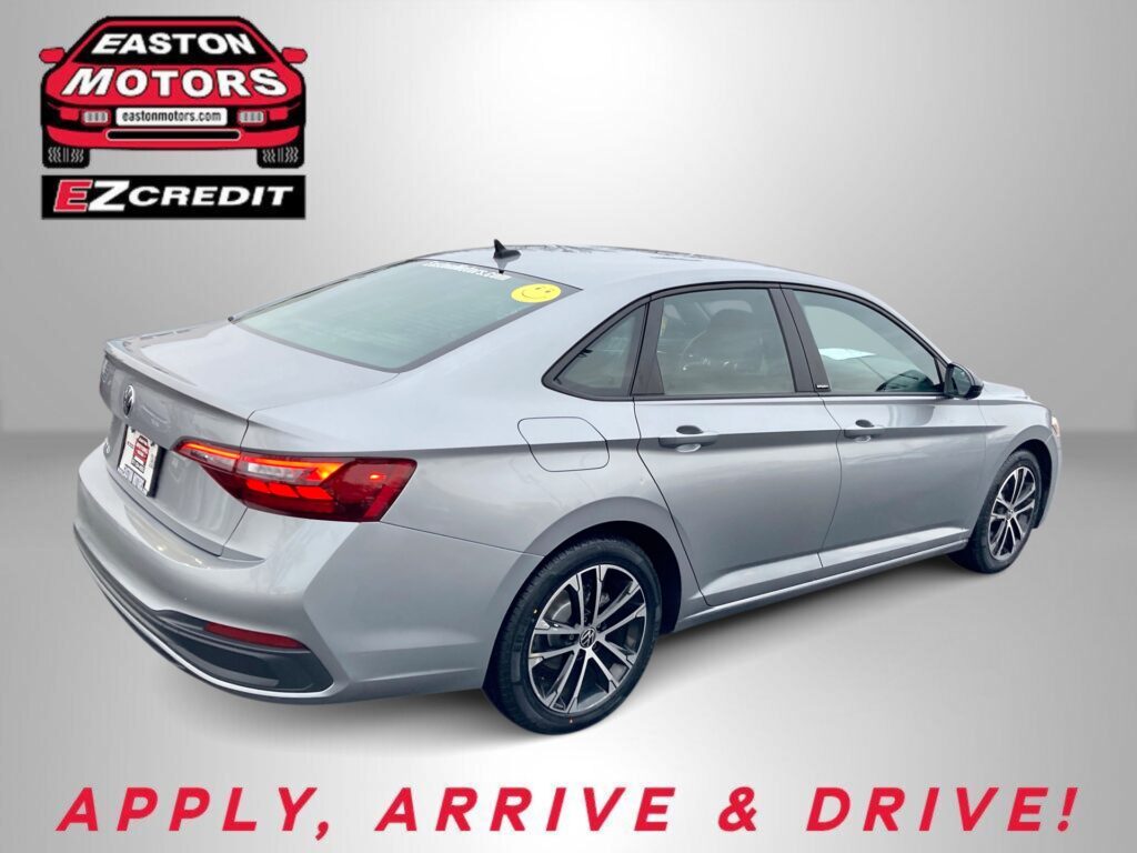 Silver sedan shown from the rear side next to an Easton Motors EZ Credit logo on a gray backdrop, with the banner text 'APPLY, ARRIVE & DRIVE!' in red at bottom.