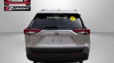 Rear view of a silver Toyota RAV4 with Easton Motors branding on the left and a yellow smiley decal on the rear window; bold red 'APPLY, ARRIVE & DRIVE!' text at the bottom.
