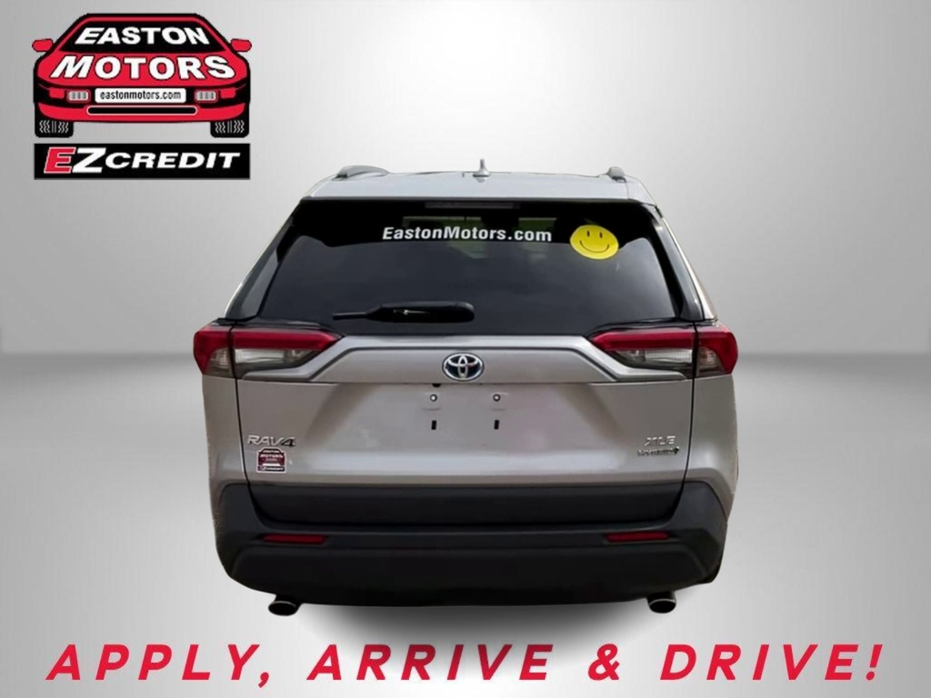 Rear view of a silver Toyota RAV4 with Easton Motors branding on the left and a yellow smiley decal on the rear window; bold red 'APPLY, ARRIVE & DRIVE!' text at the bottom.
