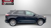 Dark gray SUV in a studio setup with Easton Motors logo and EZCredit text in the top-left corner; red banner at bottom reads 'APPLY, ARRIVE & DRIVE!'