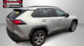 Silver SUV shown from the rear-right in a dealership setting with Easton Motors EZ Credit logo and the text "APPLY, ARRIVE & DRIVE".