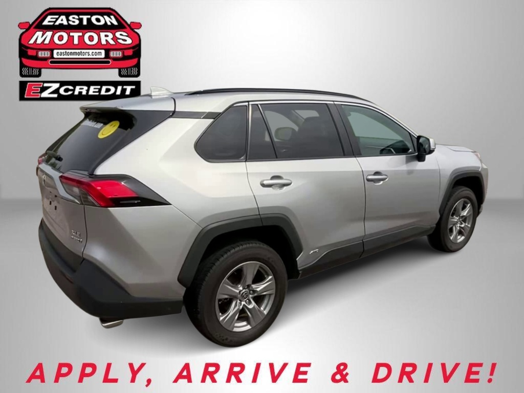 Silver SUV shown from the rear-right in a dealership setting with Easton Motors EZ Credit logo and the text "APPLY, ARRIVE & DRIVE".