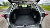 Open SUV hatch reveals spacious empty cargo area with folded rear seats and a clear view of the back of the cabin.