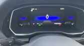 Digital car dashboard showing speed 0 mph with blue center glow, time 3:47, and outside temp ~39°F; several status icons present.
