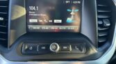 Car radio display showing 104.1 Rihanna with station info and time (4:28 PM) and temperature (58°F) on the screen, plus preset buttons below. Entertain/Info radio UI screenshot.