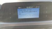 Car stereo display showing FM1, tuned to 95.7 MHz, with the program title 'Milwaukee's 80s & 90s' and the time 10:43 (outside temp 35°).