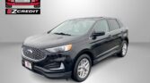 Gray Ford SUV with an Easton Motors logo on a gray backdrop and the red slogan 'APPLY, ARRIVE & DRIVE!' at the bottom.