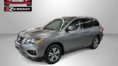 Silver SUV viewed from the front-right in a studio setting with Easton Motors EZ Credit logo in the top-left and the text 'APPLY, ARRIVE & DRIVE!' beneath it