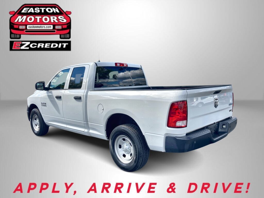 Promotional image of a white pickup truck with Easton Motors logo and EZCredit branding in the corner, inviting financing options.