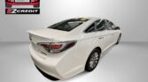 Rear three-quarter view of a white sedan in a studio, Easton Motors EZCredit logo visible on the left and 'APPLY, ARRIVE & DRIVE' text below. Another car listing highlightales this model's loan promo by Easton Motors.