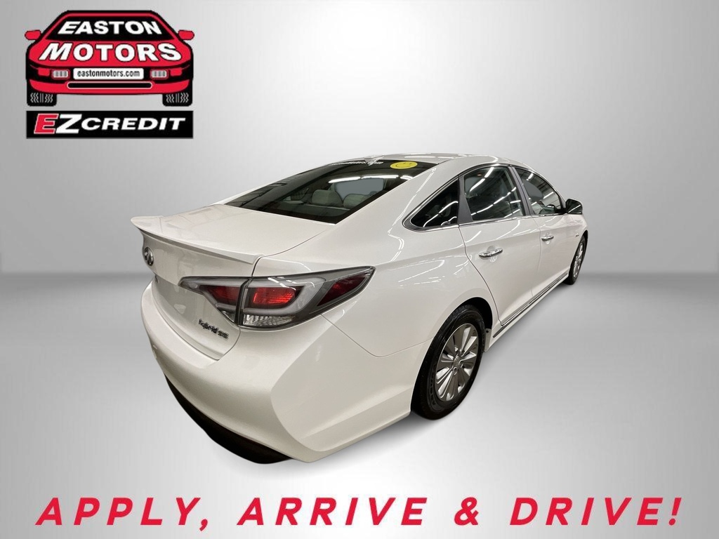 Rear three-quarter view of a white sedan in a studio, Easton Motors EZCredit logo visible on the left and 'APPLY, ARRIVE & DRIVE' text below. Another car listing highlightales this model's loan promo by Easton Motors.