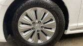 Close-up of a car wheel with a Goodyear tire and a 'blue drive' badge on a white vehicle.