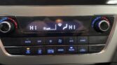 Dual-zone car climate panel with left and right temps set to HI, central display, and A/C/SYNC indicators.