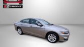 Silver sedan on a neutral gray background with Easton Motors EZCredit logos in the corner; bottom text reads 'APPLY, ARRIVE & DRIVE'.