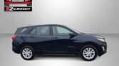 Dark blue Chevrolet Equinox SUV displayed in a dealership ad with Easton Motors and EZCredit logos in the top left and bold 'APPLY, ARRIVE & DRIVE!' text at the bottom.